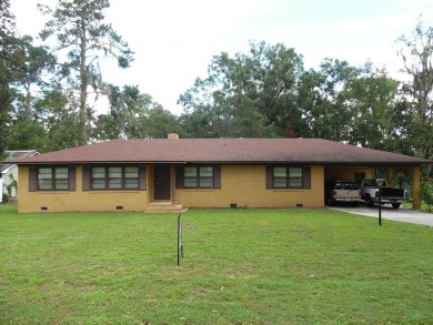 This 4BR/2BA lakefront home is just waiting on the perfect on Francis Lake Golf Club in Georgia - for sale on GolfHomes.com, golf home, golf lot