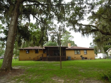 This 4BR/2BA lakefront home is just waiting on the perfect on Francis Lake Golf Club in Georgia - for sale on GolfHomes.com, golf home, golf lot