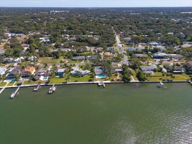 Seize the chance to own a prime 74-foot waterfront lot on The Dunedin Country Club in Florida - for sale on GolfHomes.com, golf home, golf lot
