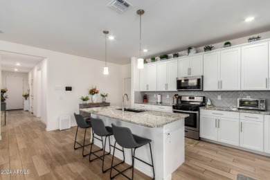 This exceptional Verrado home showcases meticulous pride of on Verrado Golf Club - Victory in Arizona - for sale on GolfHomes.com, golf home, golf lot