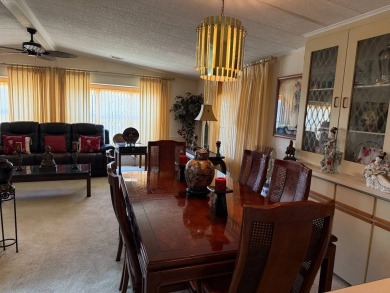 THIS LOVELY, MANUFACTURED HOME ON LEASED LAND.  PRICED TO SELL on Pine Lakes Country Club in Florida - for sale on GolfHomes.com, golf home, golf lot
