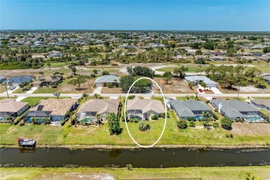 Waterfront Living in Rotonda West Nestled in the serene and on Pinemoor West Golf Club in Florida - for sale on GolfHomes.com, golf home, golf lot
