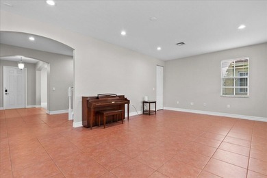 Versatile 4-bedroom, 3-bath Abacoa residence with sparkling LAKE on The Club At Admirals Cove Golf Village in Florida - for sale on GolfHomes.com, golf home, golf lot