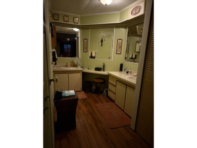 THIS LOVELY, MANUFACTURED HOME ON LEASED LAND.  PRICED TO SELL on Pine Lakes Country Club in Florida - for sale on GolfHomes.com, golf home, golf lot
