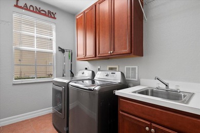 Versatile 4-bedroom, 3-bath Abacoa residence with sparkling LAKE on The Club At Admirals Cove Golf Village in Florida - for sale on GolfHomes.com, golf home, golf lot