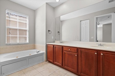 Versatile 4-bedroom, 3-bath Abacoa residence with sparkling LAKE on The Club At Admirals Cove Golf Village in Florida - for sale on GolfHomes.com, golf home, golf lot