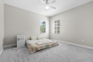 Versatile 4-bedroom, 3-bath Abacoa residence with sparkling LAKE on The Club At Admirals Cove Golf Village in Florida - for sale on GolfHomes.com, golf home, golf lot