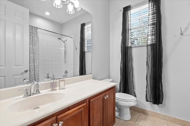 Versatile 4-bedroom, 3-bath Abacoa residence with sparkling LAKE on The Club At Admirals Cove Golf Village in Florida - for sale on GolfHomes.com, golf home, golf lot