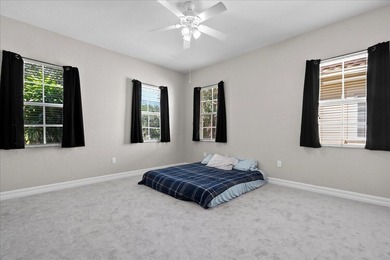 Versatile 4-bedroom, 3-bath Abacoa residence with sparkling LAKE on The Club At Admirals Cove Golf Village in Florida - for sale on GolfHomes.com, golf home, golf lot