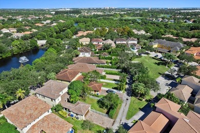 Versatile 4-bedroom, 3-bath Abacoa residence with sparkling LAKE on The Club At Admirals Cove Golf Village in Florida - for sale on GolfHomes.com, golf home, golf lot