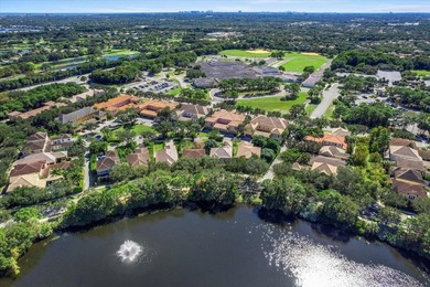 Versatile 4-bedroom, 3-bath Abacoa residence with sparkling LAKE on The Club At Admirals Cove Golf Village in Florida - for sale on GolfHomes.com, golf home, golf lot