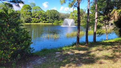 Versatile 4-bedroom, 3-bath Abacoa residence with sparkling LAKE on The Club At Admirals Cove Golf Village in Florida - for sale on GolfHomes.com, golf home, golf lot