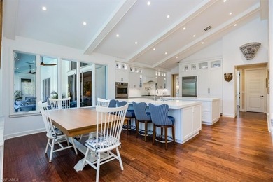 This extraordinary residence offers stunning lake and on Bentley Village Golf Course in Florida - for sale on GolfHomes.com, golf home, golf lot