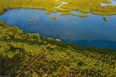 This extraordinary residence offers stunning lake and on Bentley Village Golf Course in Florida - for sale on GolfHomes.com, golf home, golf lot