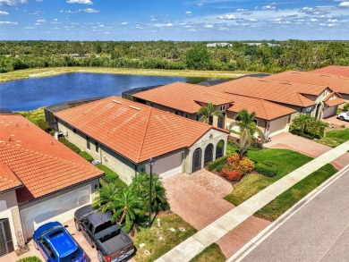 Stunning Waterfront WCI Grand Cayman in Sarasota National Lake on Sarasota National Golf Club in Florida - for sale on GolfHomes.com, golf home, golf lot