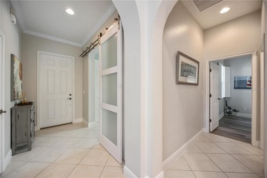 Modern updates welcome you as you step through the front door of on Venetian Golf and River Club in Florida - for sale on GolfHomes.com, golf home, golf lot