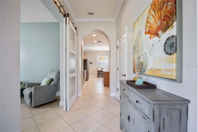 Modern updates welcome you as you step through the front door of on Venetian Golf and River Club in Florida - for sale on GolfHomes.com, golf home, golf lot