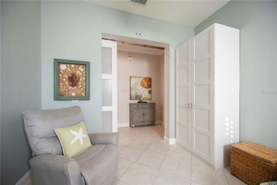 Modern updates welcome you as you step through the front door of on Venetian Golf and River Club in Florida - for sale on GolfHomes.com, golf home, golf lot