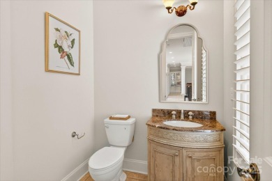 Mediterranean elegance meets luxury living in this stately on TPC at Piper Glen in North Carolina - for sale on GolfHomes.com, golf home, golf lot