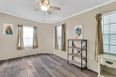 Beautifully maintained 2005 furnished home on a spacious lot. 1 on Barefoot Bay Golf Course in Florida - for sale on GolfHomes.com, golf home, golf lot