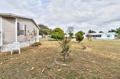 Beautifully maintained 2005 furnished home on a spacious lot. 1 on Barefoot Bay Golf Course in Florida - for sale on GolfHomes.com, golf home, golf lot