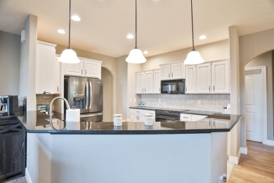Elegant and expansive 5-bedroom, 3-bathroom home nestled in the on Ledgestone Country Club and Golf Course in Missouri - for sale on GolfHomes.com, golf home, golf lot