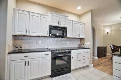 Elegant and expansive 5-bedroom, 3-bathroom home nestled in the on Ledgestone Country Club and Golf Course in Missouri - for sale on GolfHomes.com, golf home, golf lot
