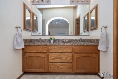 Nestled in the exclusive community of The Dunes, this beautiful on Desert Hills Golf Course in Arizona - for sale on GolfHomes.com, golf home, golf lot