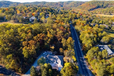 Elegant and expansive 5-bedroom, 3-bathroom home nestled in the on Ledgestone Country Club and Golf Course in Missouri - for sale on GolfHomes.com, golf home, golf lot