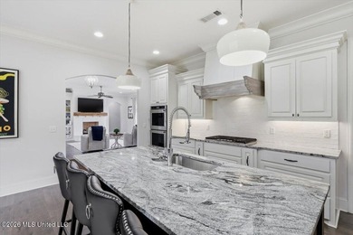 Golf course and lake views come together at 387 Caroline Blvd in on Lake Caroline Golf Club in Mississippi - for sale on GolfHomes.com, golf home, golf lot