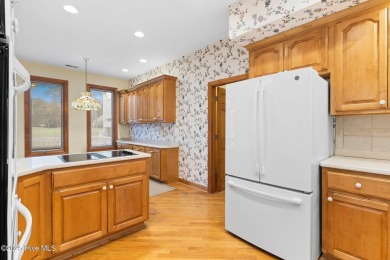 This unique, custom-built home rests on nearly  3/4  of an acre on Lockwood Folly Country Club in North Carolina - for sale on GolfHomes.com, golf home, golf lot