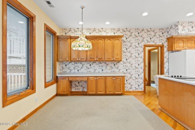 This unique, custom-built home rests on nearly  3/4  of an acre on Lockwood Folly Country Club in North Carolina - for sale on GolfHomes.com, golf home, golf lot