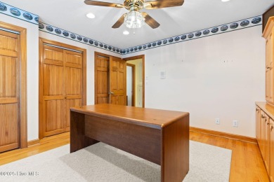 This unique, custom-built home rests on nearly  3/4  of an acre on Lockwood Folly Country Club in North Carolina - for sale on GolfHomes.com, golf home, golf lot