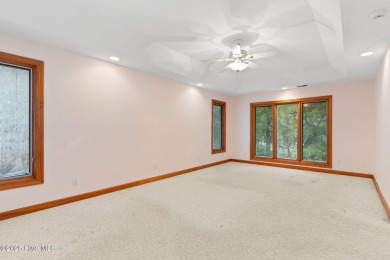 This unique, custom-built home rests on nearly  3/4  of an acre on Lockwood Folly Country Club in North Carolina - for sale on GolfHomes.com, golf home, golf lot