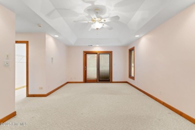 This unique, custom-built home rests on nearly  3/4  of an acre on Lockwood Folly Country Club in North Carolina - for sale on GolfHomes.com, golf home, golf lot