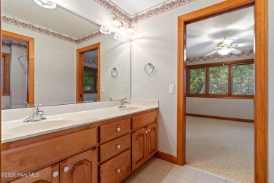 This unique, custom-built home rests on nearly  3/4  of an acre on Lockwood Folly Country Club in North Carolina - for sale on GolfHomes.com, golf home, golf lot