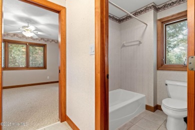This unique, custom-built home rests on nearly  3/4  of an acre on Lockwood Folly Country Club in North Carolina - for sale on GolfHomes.com, golf home, golf lot