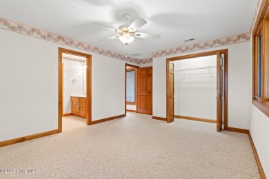 This unique, custom-built home rests on nearly  3/4  of an acre on Lockwood Folly Country Club in North Carolina - for sale on GolfHomes.com, golf home, golf lot