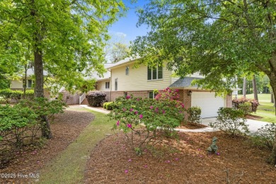 This unique, custom-built home rests on nearly  3/4  of an acre on Lockwood Folly Country Club in North Carolina - for sale on GolfHomes.com, golf home, golf lot