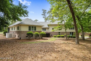 This unique, custom-built home rests on nearly  3/4  of an acre on Lockwood Folly Country Club in North Carolina - for sale on GolfHomes.com, golf home, golf lot