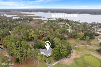 This unique, custom-built home rests on nearly  3/4  of an acre on Lockwood Folly Country Club in North Carolina - for sale on GolfHomes.com, golf home, golf lot