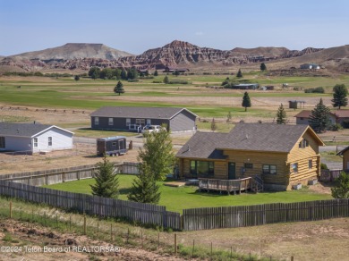 Nestled in the heart of Dubois, this authentic Swedish Cope log on Antelope Hills Golf Course in Wyoming - for sale on GolfHomes.com, golf home, golf lot