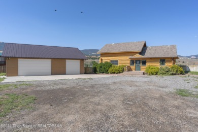 Nestled in the heart of Dubois, this authentic Swedish Cope log on Antelope Hills Golf Course in Wyoming - for sale on GolfHomes.com, golf home, golf lot