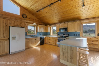 Nestled in the heart of Dubois, this authentic Swedish Cope log on Antelope Hills Golf Course in Wyoming - for sale on GolfHomes.com, golf home, golf lot