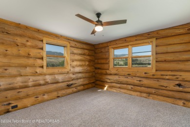 Nestled in the heart of Dubois, this authentic Swedish Cope log on Antelope Hills Golf Course in Wyoming - for sale on GolfHomes.com, golf home, golf lot