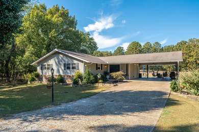 Full of personality and charm, this Diamondhead 2 bed 2.5 bath on Diamondhead Golf and Country Club in Arkansas - for sale on GolfHomes.com, golf home, golf lot