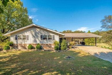 Full of personality and charm, this Diamondhead 2 bed 2.5 bath on Diamondhead Golf and Country Club in Arkansas - for sale on GolfHomes.com, golf home, golf lot
