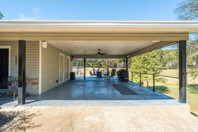 Full of personality and charm, this Diamondhead 2 bed 2.5 bath on Diamondhead Golf and Country Club in Arkansas - for sale on GolfHomes.com, golf home, golf lot