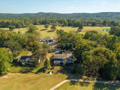 Full of personality and charm, this Diamondhead 2 bed 2.5 bath on Diamondhead Golf and Country Club in Arkansas - for sale on GolfHomes.com, golf home, golf lot