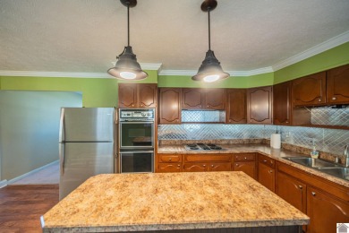 Two bedroom, 1.5-bath brick home offering 1,680 sq ft of on Calvert City Golf and Country Club in Kentucky - for sale on GolfHomes.com, golf home, golf lot